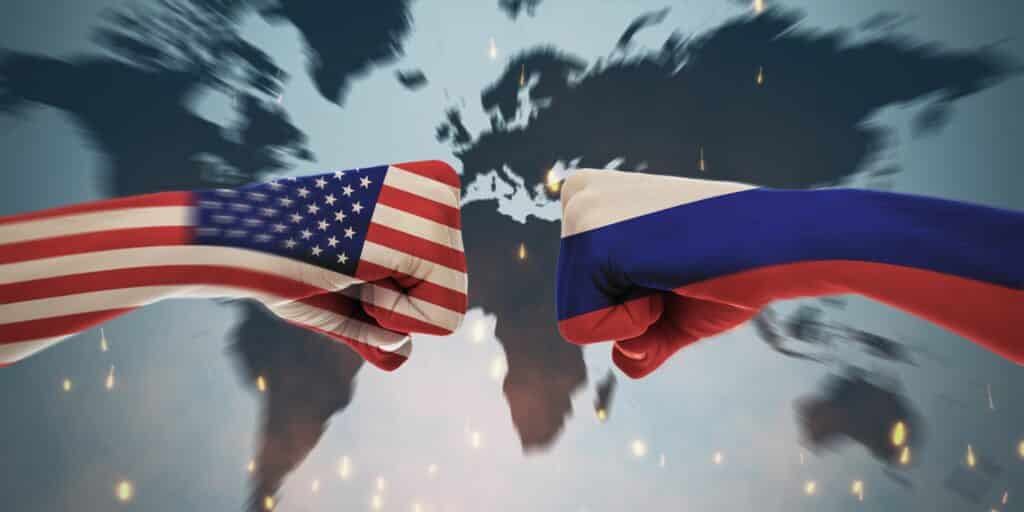 U.S. and Russian Flags painted on face to face ists