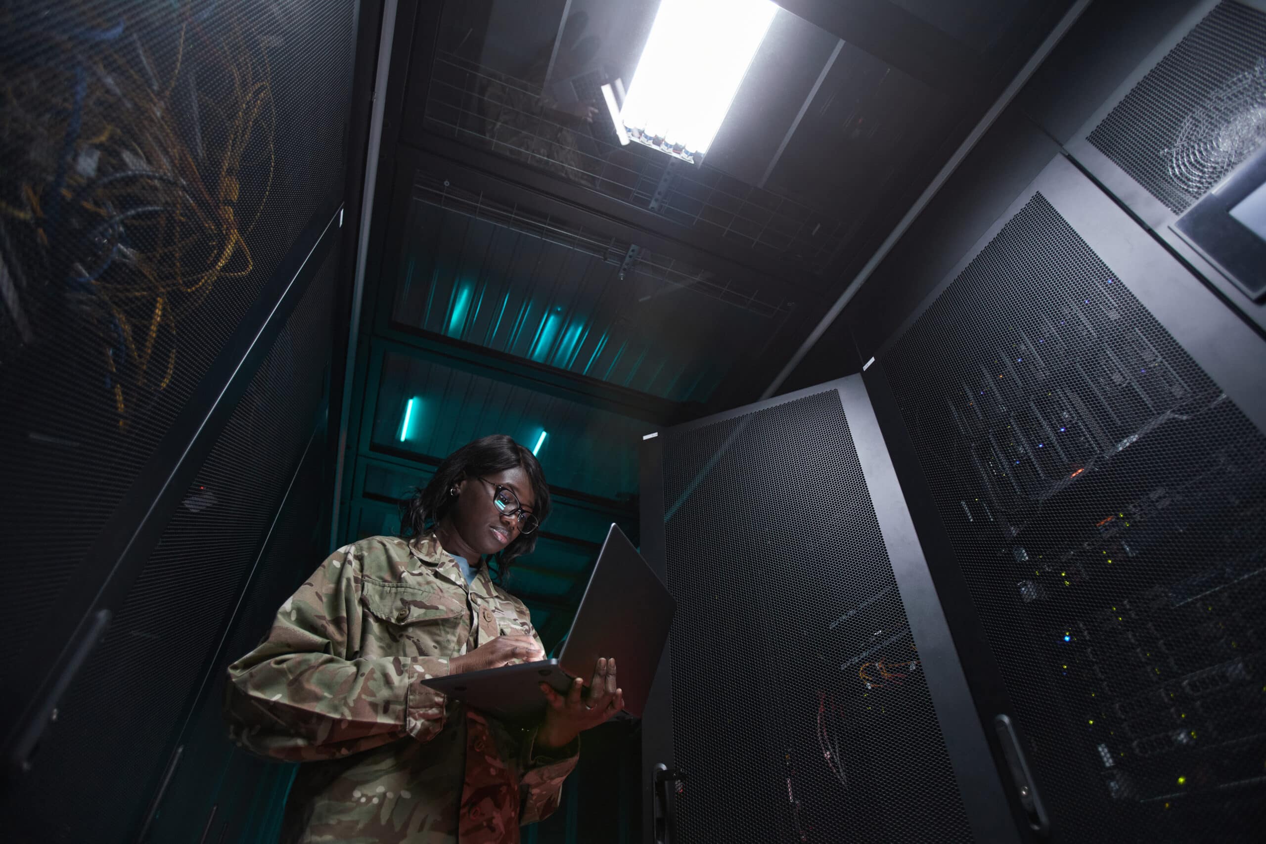 Military Network Technician Inspecting Server